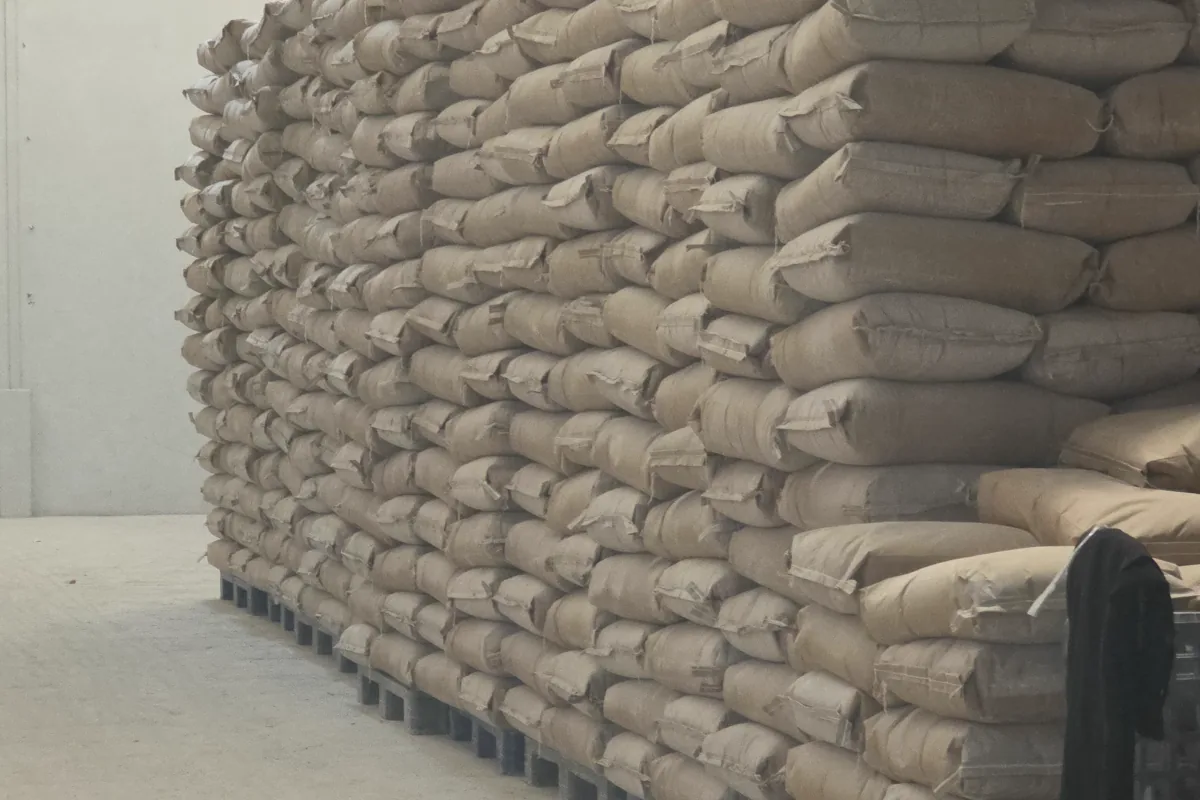 Large palletized stock of industrial material bags in a warehouse